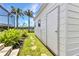 Exterior view of the shed behind a home near a waterway, surrounded by lush greenery at 18382 Arapahoe Cir, Port Charlotte, FL 33948