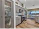 Well-appointed kitchen featuring stainless steel appliances, light gray cabinetry, and stylish backsplash at 18382 Arapahoe Cir, Port Charlotte, FL 33948