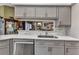 Kitchen sink with stainless steel appliances and light countertops at 18382 Arapahoe Cir, Port Charlotte, FL 33948