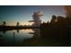 Twilight view of clouds reflecting on the water's surface at 18382 Arapahoe Cir, Port Charlotte, FL 33948