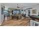 Spacious living room with wood-look tile flooring, ample seating and an open floor plan at 18382 Arapahoe Cir, Port Charlotte, FL 33948