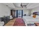 Spacious main bedroom featuring tray ceiling, wood floors, and pool views at 18382 Arapahoe Cir, Port Charlotte, FL 33948