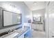 Bathroom featuring dual vanities, granite countertops, and modern fixtures at 1903 San Silvestro Dr, Venice, FL 34285