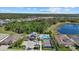 Community oasis with a pool, tennis court, and clubhouse, nestled among beautifully landscaped grounds at 19800 Montenero Way, Venice, FL 34293