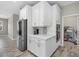 Well-equipped kitchen with stainless steel appliances, ample cabinet space, and modern design at 19800 Montenero Way, Venice, FL 34293