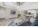 Spacious living room with sleek furniture, a large TV, and an open layout at 19800 Montenero Way, Venice, FL 34293