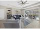 Relaxing living room featuring comfortable seating and view to backyard at 19800 Montenero Way, Venice, FL 34293