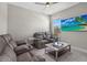 Comfortable living room with reclining leather sofas and a flat screen tv for entertainment at 19800 Montenero Way, Venice, FL 34293