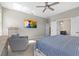 Relaxing bedroom with neutral tones, plush carpeting, and walk-in closet access at 19800 Montenero Way, Venice, FL 34293