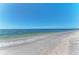 Beautiful beach with clear water, gentle waves, and fine sand, perfect for relaxation at 19911 Quisto St, Venice, FL 34293