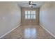 Cozy bedroom with tile floors, window, and ceiling fan at 19911 Quisto St, Venice, FL 34293