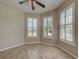 Versatile room with tile flooring, ceiling fan, and plantation shutters, offering bright, natural light at 19911 Quisto St, Venice, FL 34293