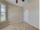 Light-filled room with tile flooring, featuring a closet and large windows with plantation shutters at 19911 Quisto St, Venice, FL 34293