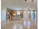 Spacious kitchen with tile floors, stainless steel appliances, and island at 19911 Quisto St, Venice, FL 34293