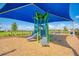 Community playground with shade covering, a slide and lush green landscaping perfect for Gathering fun at 19911 Quisto St, Venice, FL 34293