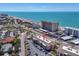 Aerial view of building with beach access and a vibrant coastal setting at 200 The Esplanade N # B3, Venice, FL 34285