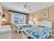 Bedroom with two beds, dressers, and a window providing great light at 200 The Esplanade N # B3, Venice, FL 34285