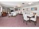 Bright community room with multiple seating arrangements, fireplace and built-in shelving at 200 The Esplanade N # B3, Venice, FL 34285