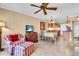 Open-concept living space with tile flooring, integrated with a cozy dining area and an open kitchen at 200 The Esplanade N # B3, Venice, FL 34285