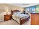 Main bedroom with a comfortable bed, lamps, and nice decor at 200 The Esplanade N # B3, Venice, FL 34285