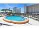 Community pool area with lounge chairs, surrounded by lush landscaping and buildings at 200 The Esplanade N # B3, Venice, FL 34285