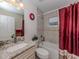 Bathroom with granite countertop vanity, tiled walls, and shower-tub combination at 2098 Zellwood Ter, North Port, FL 34286