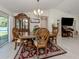 Traditional dining room featuring a wooden table, chairs, and china cabinet at 2098 Zellwood Ter, North Port, FL 34286