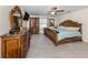 Spacious primary bedroom featuring elegant furnishings, a ceiling fan, and great natural light at 2098 Zellwood Ter, North Port, FL 34286