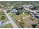 Overhead view of home with pool and shed in spacious, fenced backyard at 2102 Alaric St, Port Charlotte, FL 33952