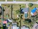Aerial view showcasing the property's expansive fenced yard and proximity to neighborhood amenities at 2102 Alaric St, Port Charlotte, FL 33952