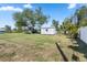 The well-maintained backyard features a shed for extra storage and plenty of space for outdoor activities at 2102 Alaric St, Port Charlotte, FL 33952