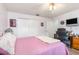 Bright bedroom with a sliding door closet, ceiling fan, and a nearby desk at 2102 Alaric St, Port Charlotte, FL 33952