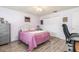 Inviting bedroom with closet space, ceiling fan, comfortable bed, and nearby desk at 2102 Alaric St, Port Charlotte, FL 33952