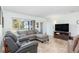 Comfortable living room with tile floors, a large window, and a relaxing seating area at 2102 Alaric St, Port Charlotte, FL 33952