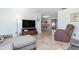 Spacious living area flowing into the dining space, perfect for entertaining and relaxation at 2102 Alaric St, Port Charlotte, FL 33952