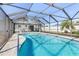 View of pool and patio screened in for comfortable enjoyment and entertainment at 2102 Alaric St, Port Charlotte, FL 33952