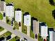 The aerial view captures a neighborhood with driveways, cars, and well-maintained green spaces at 223 Lancer Dr, Nokomis, FL 34275