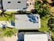 The aerial view of homes with driveways and green lawns shows well-maintained properties at 223 Lancer Dr, Nokomis, FL 34275