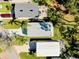 The aerial view of homes with driveways and green lawns shows well-maintained properties at 223 Lancer Dr, Nokomis, FL 34275