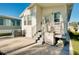 Home's back porch with outdoor storage; adjacent to well-maintained backyard lawn at 223 Lancer Dr, Nokomis, FL 34275