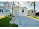 Inviting home featuring a well-maintained lawn and a long driveway at 223 Lancer Dr, Nokomis, FL 34275