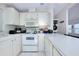 Bright white kitchen featuring modern appliances and ample counter space at 223 Lancer Dr, Nokomis, FL 34275