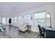 Comfortable living room with laminate flooring, vaulted ceiling, and plenty of natural light at 223 Lancer Dr, Nokomis, FL 34275