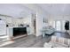 Open concept living area with stylish laminate flooring, and seamless flow to the kitchen at 223 Lancer Dr, Nokomis, FL 34275