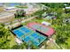 Aerial view of tennis and pickleball courts, perfect for active community recreation at 223 Lancer Dr, Nokomis, FL 34275