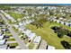 Aerial view of community featuring manicured lawns, mature trees, and peaceful atmosphere at 233 Bainbridge Dr, Nokomis, FL 34275