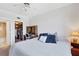 Comfortable bedroom with a well-organized closet and a dedicated workspace at 238 Tampa W Ave # 217, Venice, FL 34285