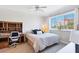 Bright bedroom with a large window, ceiling fan, and dedicated workspace at 238 Tampa W Ave # 6B, Venice, FL 34285