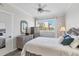 Comfortable bedroom with wicker furniture, soft lighting, and a relaxing atmosphere at 238 Tampa W Ave # 217, Venice, FL 34285