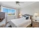 Cozy bedroom with wicker furniture, a ceiling fan, and a bright window view at 238 Tampa W Ave # 217, Venice, FL 34285